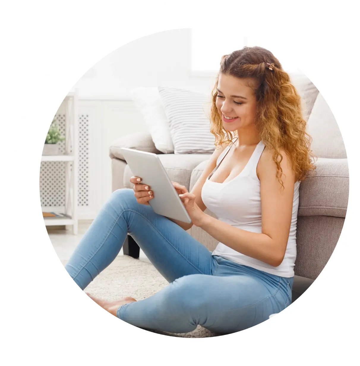 Woman smiling while using a tablet.